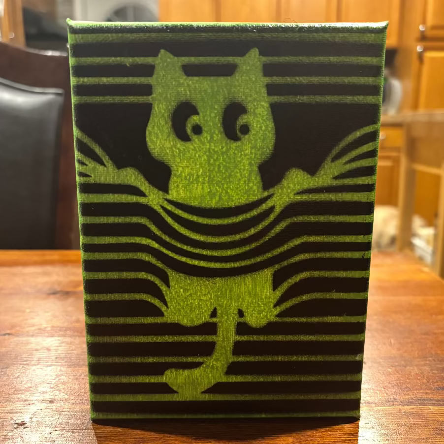 Cat peeking painting