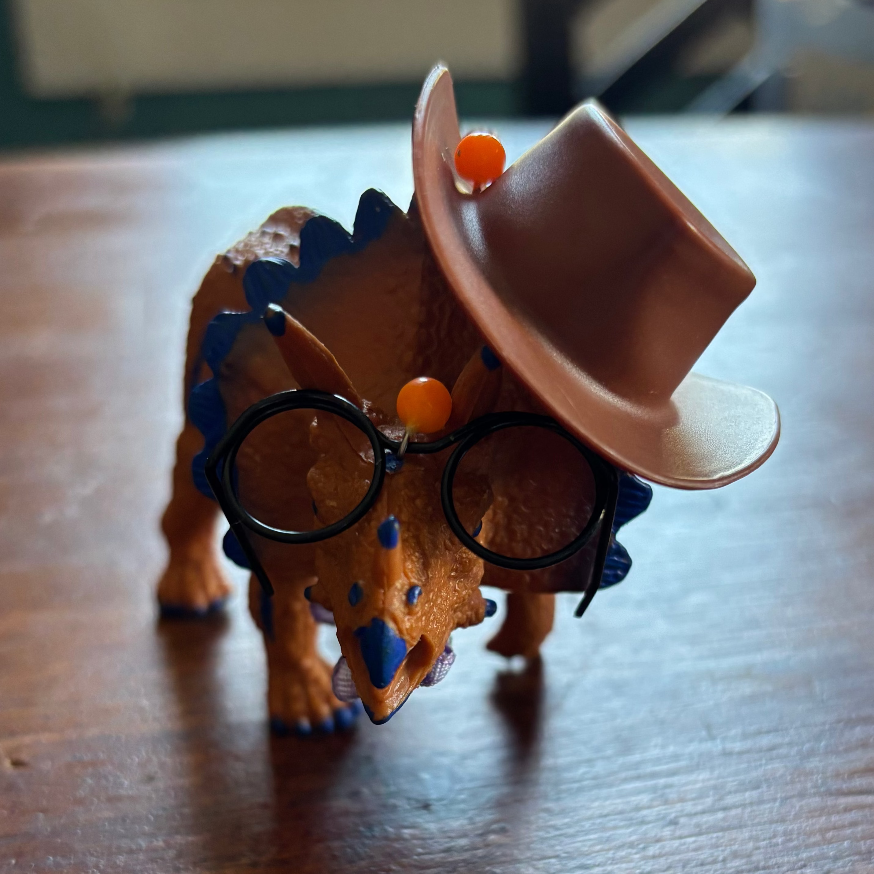 Colorful Dinosaur with Hat and Bow Tie